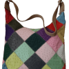 Dive into a realm of dynamic style with our Multifaceted Mosaic Handbag, an exquisite fusion of colors and patterns.